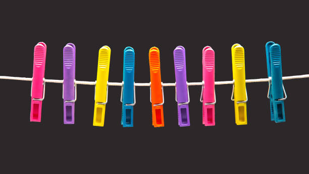 istock colored plastic clothespins hanging on a rope 1448801333