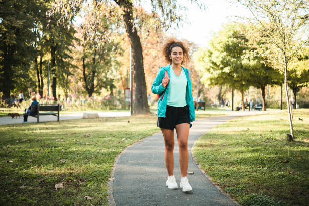 istock Happy girl going to exercise in the park 1448803349
