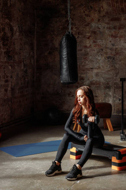 istock Young woman in tracksuit 1448803433