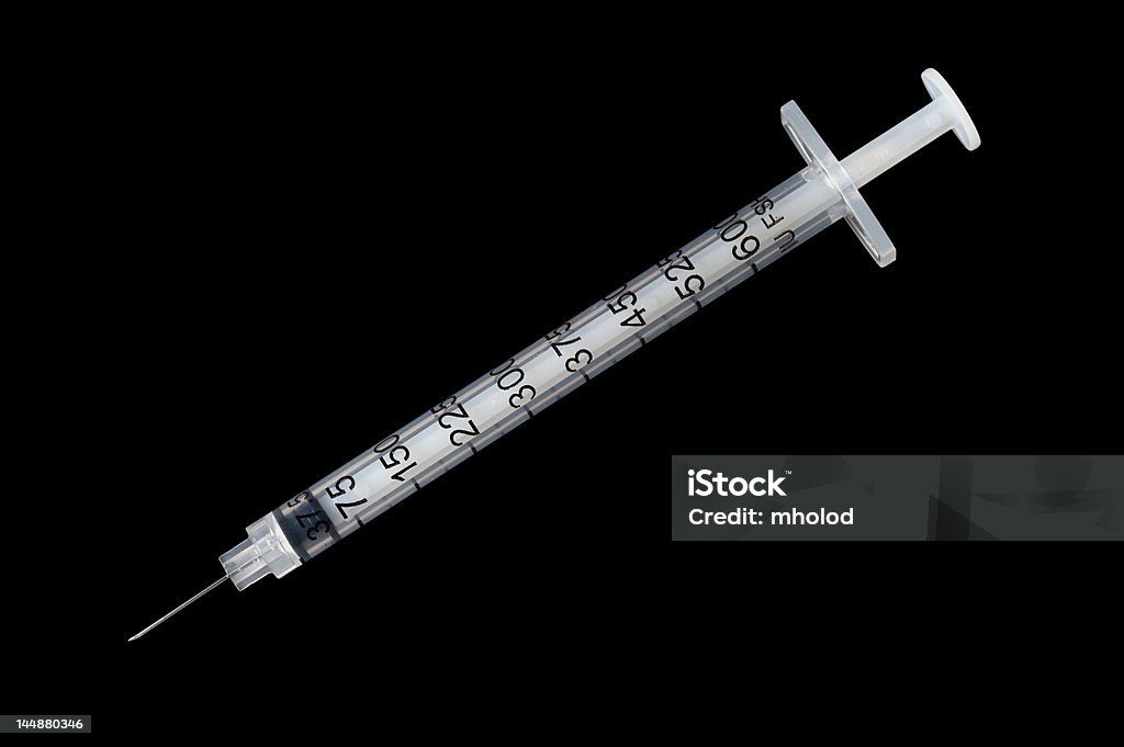 Insulin Syringe Hypodermic syringe with finer gauge needle for less pain, isolated on black background Addiction Stock Photo