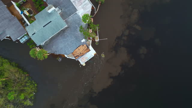 Flooded houses by hurricane Ian rainfall in Florida residential area. Consequences of natural disaster