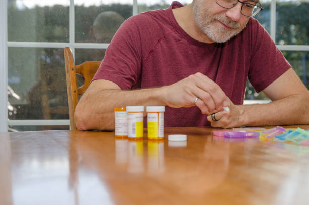 istock Mature man taking his medicine 1448805581