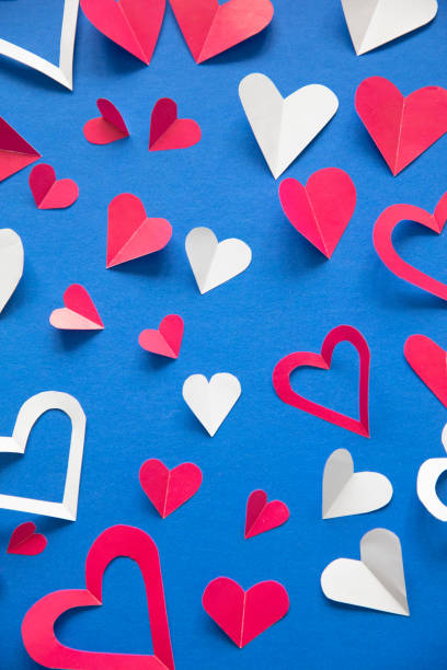 istock Valentine Day paper Background with Hearts multicolored Pattern 1448805894