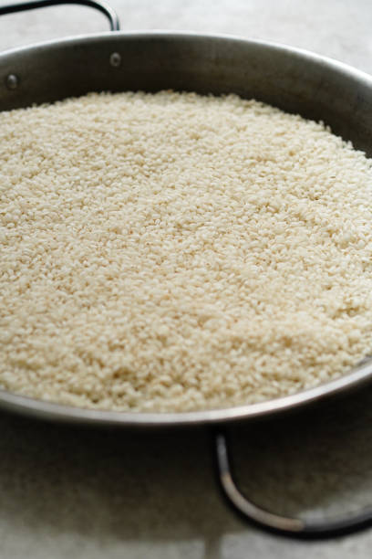 istock Closeup of white rice in paella pans 1448806313