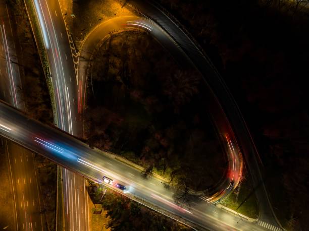 istock Aerial view of an exit ramp of a highway at night 1448806385