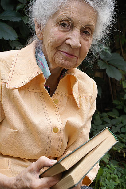 istock Senior woman with book 144880763