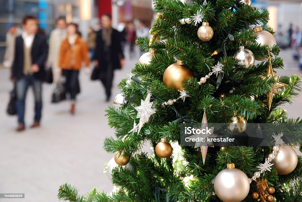 Christmas mall Shoppers in mall by christmas tree. Japan Stock Photo