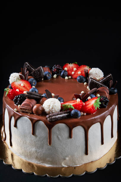 istock Cake decorated with strawberry and chocolate on dark background 1448810917