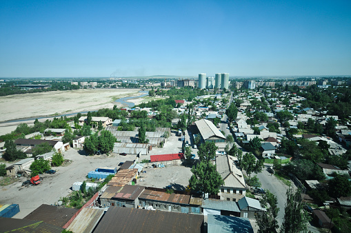 Almaty City with the man made Sayran Lake (dry). The image shows a residential district of Almaty City with the dry Saran water Reervoir, capture during summer season