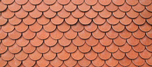 Old red clay traditional spanish tile rooftop, full frame view, suitable for backgrounds. Galicia, Spain.