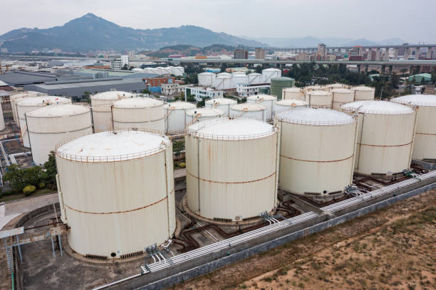 istock Oil storage tanks under cloudy sky 1448817338