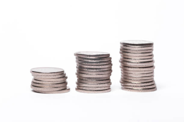 istock Three stacks of coins isolated on white background 1448819256