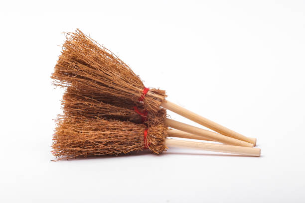 istock Halloween witch's brooms isolated on white background 1448820986