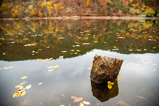 Beautiful autumn colors of Forest House  and lake reflection in Boraboy Lake and like wallpaper