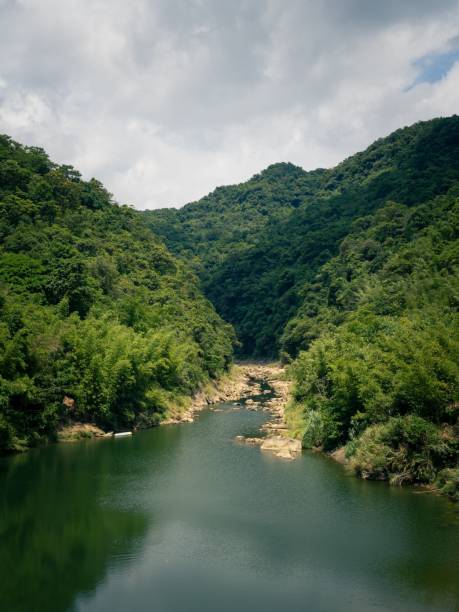 istock Scenic view of a green hills with a front lake 1448836248