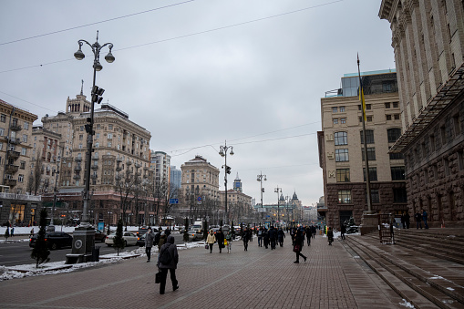 Kyiv, Ukraine - Decemember 13, 2022: Pedestrians walk on a winter afternoon on Khreschatyk Street in Kyiv.