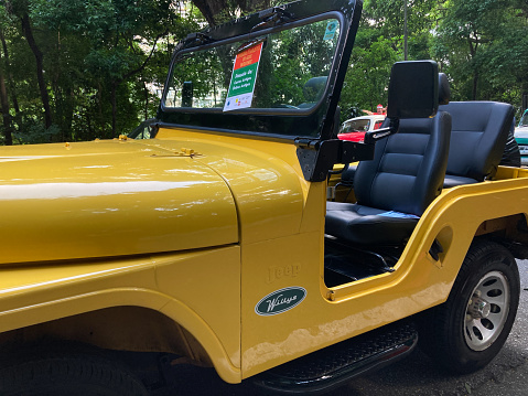 Jeep Willys in yellow on a tour celebrating 131 years of Avenida Paulista