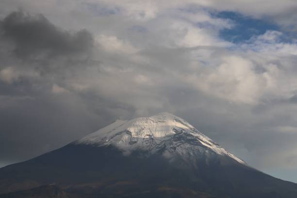 istock Landscape view Popocatepetl volcano with cloudy sky background 1448841836