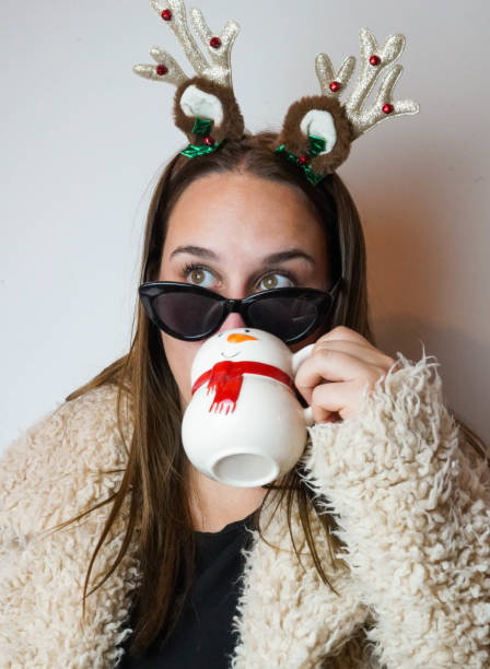istock Girl with a reindeer headband 1448842156