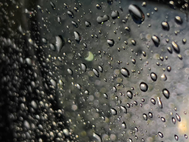 istock Raindrops on the glass at night. 1448842819