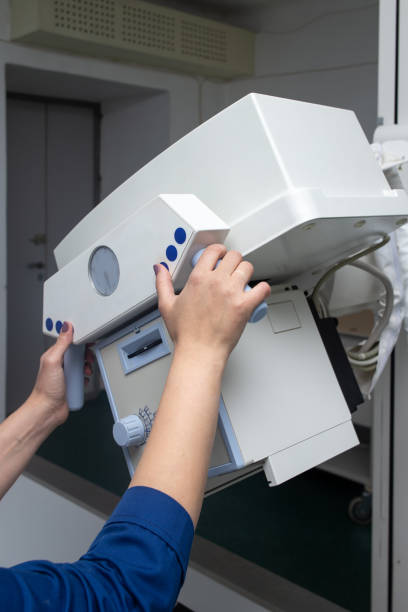 istock The radiologist prepares the X-ray machine for work. 1448843905