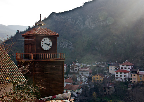 Mudurnu Bolu View. Residents are on the streets near traditional and historical Anatolian houses view with old wooden clock tower and Yıldırım Cami (mosque built in 1382. Houses built by ottomans in 19th century in Mudurnu which is located eastern bolu city, turkey.