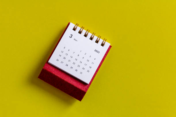 istock March 2023. Calendar for March 2023 on a yellow background. 1448844376