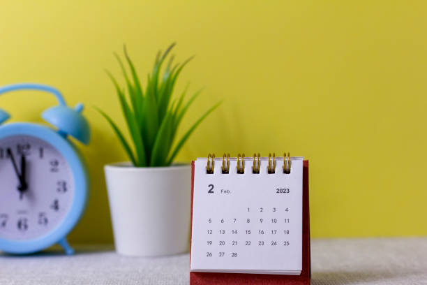 istock Desktop calendar for February 2023 on the table. 1448844474