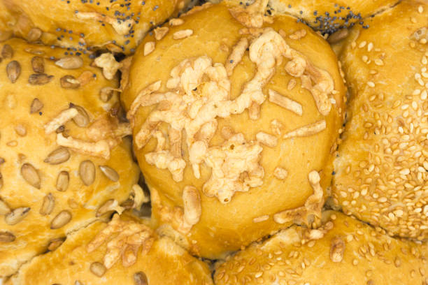 istock Fresh fluffy buns sprinkled with seeds, Close-up. Food background. 1448844654