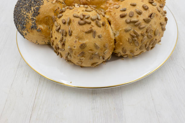 Burger bread buns in a row with sesame seeds on top.Stock photo