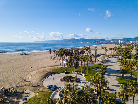 Aerial photography of the venice beach boardwalk, shops, vendors, venice skate park, roller skating area, graffiti walls, beach, and other public areas. Photos taken with a drone during the December in Los Angeles.