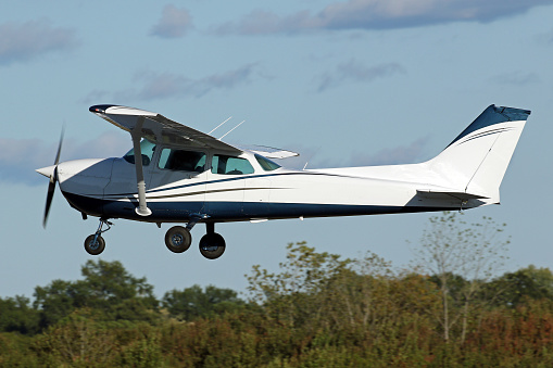 A privately owned Cessna 172 Skyhawk training aircraft taking off from the Peachtree Dekalb (PDK) airport, Atlanta, GA.  October 2022.