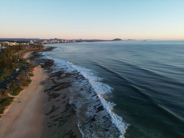 istock Aerial view of ocean waves with foam on a beach 1448864100