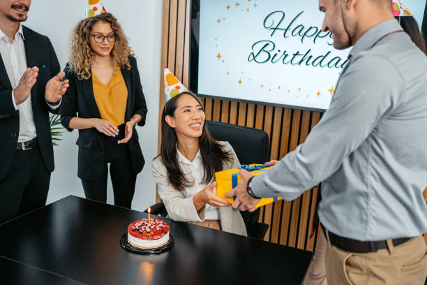istock Group Of People Having An Office Birthday Party 1448867656