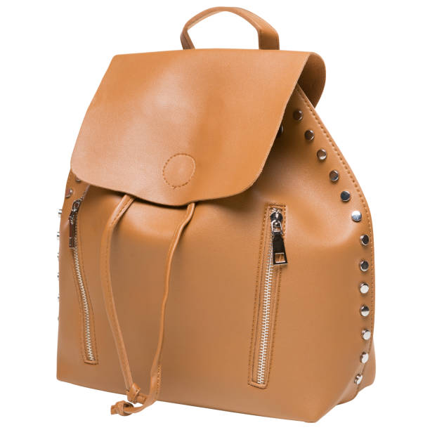 istock Brown women's bag-backpack, minimalist design, with decorative studs, on a white background 1448867665