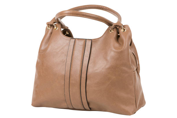 istock Soft leather women's brown bag, with two handles, on a white background 1448867692