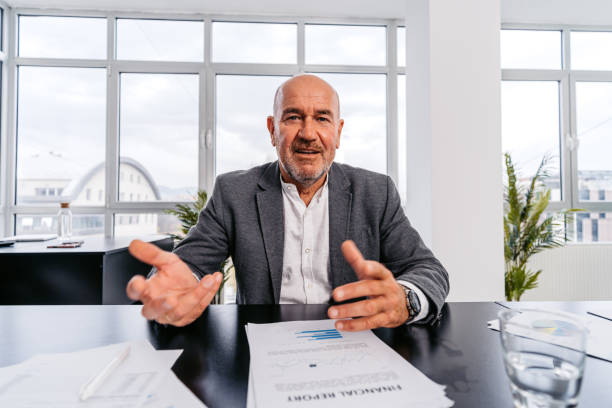 istock Mid Adult Businessman Having A Video Call With A Client 1448868121