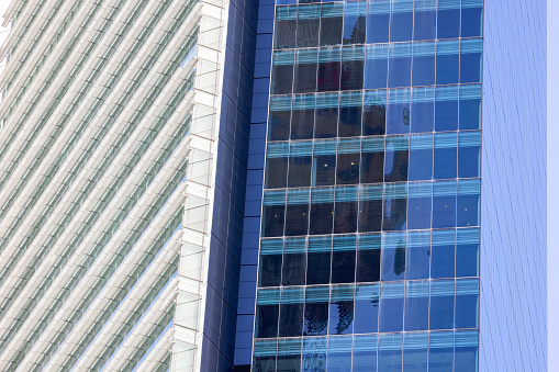 Closeup modern corporate buildings, abstract background with copy space, full frame horizontal composition