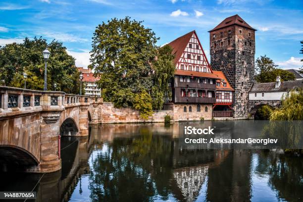Scenic View Of Old Town And Hangmans Bridge Over Pegnitz River In Nuremberg Germany Stock Photo - Download Image Now