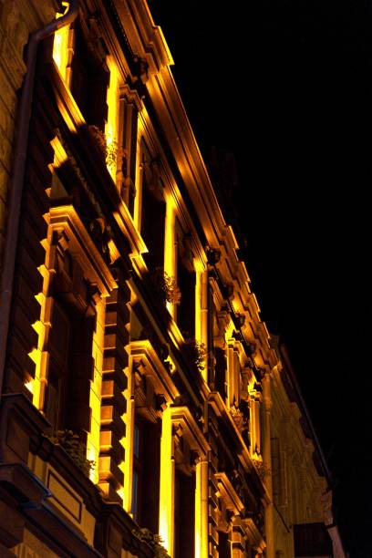 istock Vertical shot of a building with lights at night 1448873239