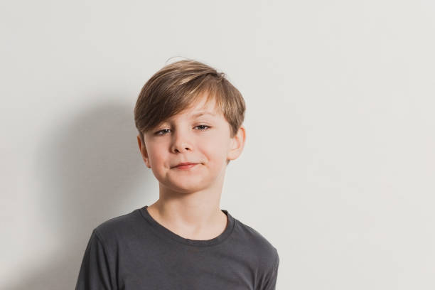 istock a portrait of cute boy pulling faces, snooty look 1448874885