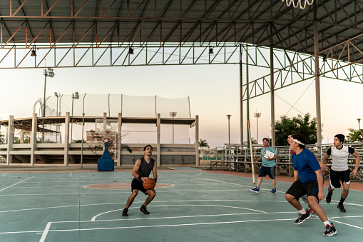 Basketball team having a match at a sports court