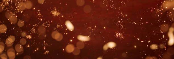 istock festive abstract red background with yellow glitter particles 1448875556
