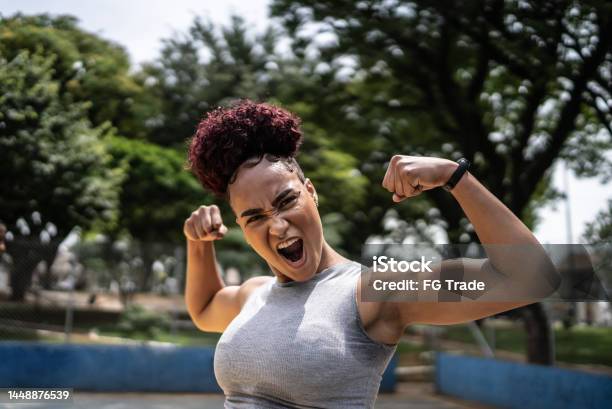 Portrait Of A Young Woman Celebrating At A Sports Court Stock Photo - Download Image Now