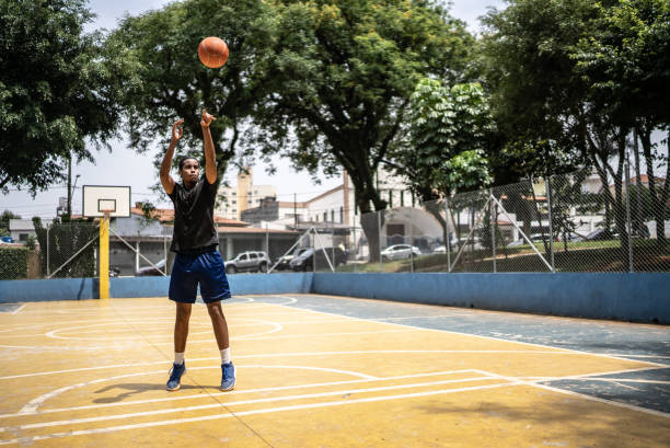 istock Young man shooting the ball to the basket 1448876626