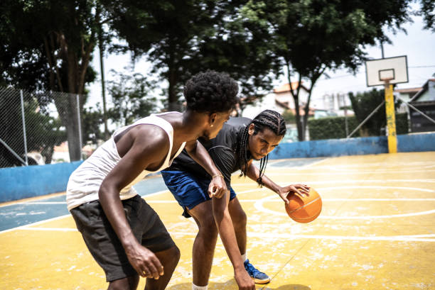 istock Young men playing basketball 1448876905