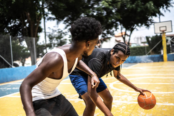 istock Young men playing basketball 1448876909