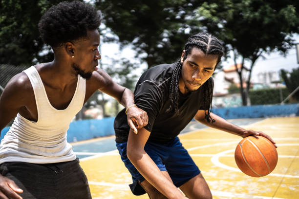 istock Young men playing basketball 1448876911