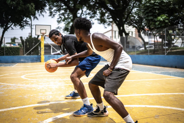 istock Young men playing basketball 1448876932