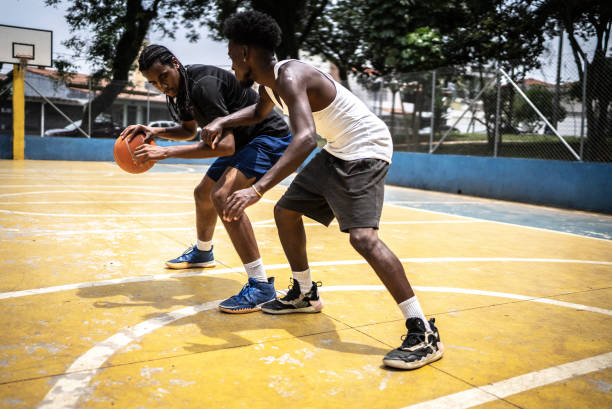 istock Young men playing basketball 1448876941